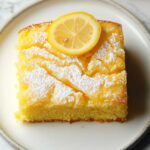 A Lemon Cake to Die for! 5 # A Lemon Cake to Die for! ### Introduction: Indulge in the tangy sweetness of this Lemon Cake that is sure to delight your taste buds. This recipe is not only delicious but also incredibly easy to make, making it perfect for any occasion from a casual weekend brunch to a special celebration. ### Why You’ll Love This Recipe? 1. Bursting with refreshing lemon flavors that are both zesty and sweet. 2. Quick and simple prep time, perfect for busy schedules or last-minute dessert needs. ### Ingredient Notes: For the cake: - Yellow cake mix: Provides a moist and tender base for the cake. - Instant lemon pudding mix: Infuses the cake with intense lemon flavor and adds a creamy texture. - Water, oil, eggs: Bind the ingredients together and ensure a fluffy and light cake. For the soaking syrup: - Powdered sugar, lemon juice, unsalted butter, melted, water: Creates a sweet and tangy glaze that keeps the cake moist and flavorful. ### Step-by-Step Instructions: 1. Preheat the oven and prepare the cake batter according to the instructions on the box. 2. Bake the cake in a preheated oven until a toothpick inserted into the center comes out clean. 3. While the cake is baking, prepare the soaking syrup by combining powdered sugar, lemon juice, melted butter, and water in a saucepan. 4. Once the cake is baked, poke holes in the top with a fork and pour the soaking syrup over the warm cake. 5. Allow the cake to cool before serving and enjoy the delicious lemony goodness! ### Helpful Tips: - For an extra lemony kick, add lemon zest to the cake batter. - Serve the cake with a dollop of whipped cream or a scoop of vanilla ice cream for a decadent treat. - Store any leftovers in an airtight container in the refrigerator for up to 3 days. ### Expert Tips for the Best Results: 1. Use fresh lemon juice for a more vibrant flavor. 2. Allow the cake to sit for at least an hour after adding the soaking syrup to fully absorb the flavors. ### Serving Suggestions: Pair this Lemon Cake with a cup of hot tea or a refreshing glass of iced lemonade for the ultimate citrus experience. ### Storage and Reheating Tips: To keep the cake fresh, cover it with plastic wrap or foil and store it in the refrigerator. Reheat individual slices in the microwave for a few seconds before serving. ### Frequently Asked Questions: 1. Can I use a different flavor of pudding mix? - Yes, you can experiment with different pudding flavors to create unique variations of this cake. 2. How can I make this recipe dairy-free? - Substitute the butter in the soaking syrup with a dairy-free alternative for a lactose-free version. 3. Can I freeze this cake? - Yes, you can freeze this cake for up to 3 months. Thaw in the refrigerator before serving. 4. Can I use fresh lemons instead of lemon juice? - Absolutely! Freshly squeezed lemon juice will enhance the flavor of the cake even more. ### Conclusion: Delight your friends and family with this irresistible Lemon Cake and watch as they rave about its deliciously tangy taste. Don't forget to share your baking success stories and feedback with us!
