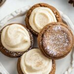 Ginger Molasses Sandwich Cookies with Eggnog Frosting