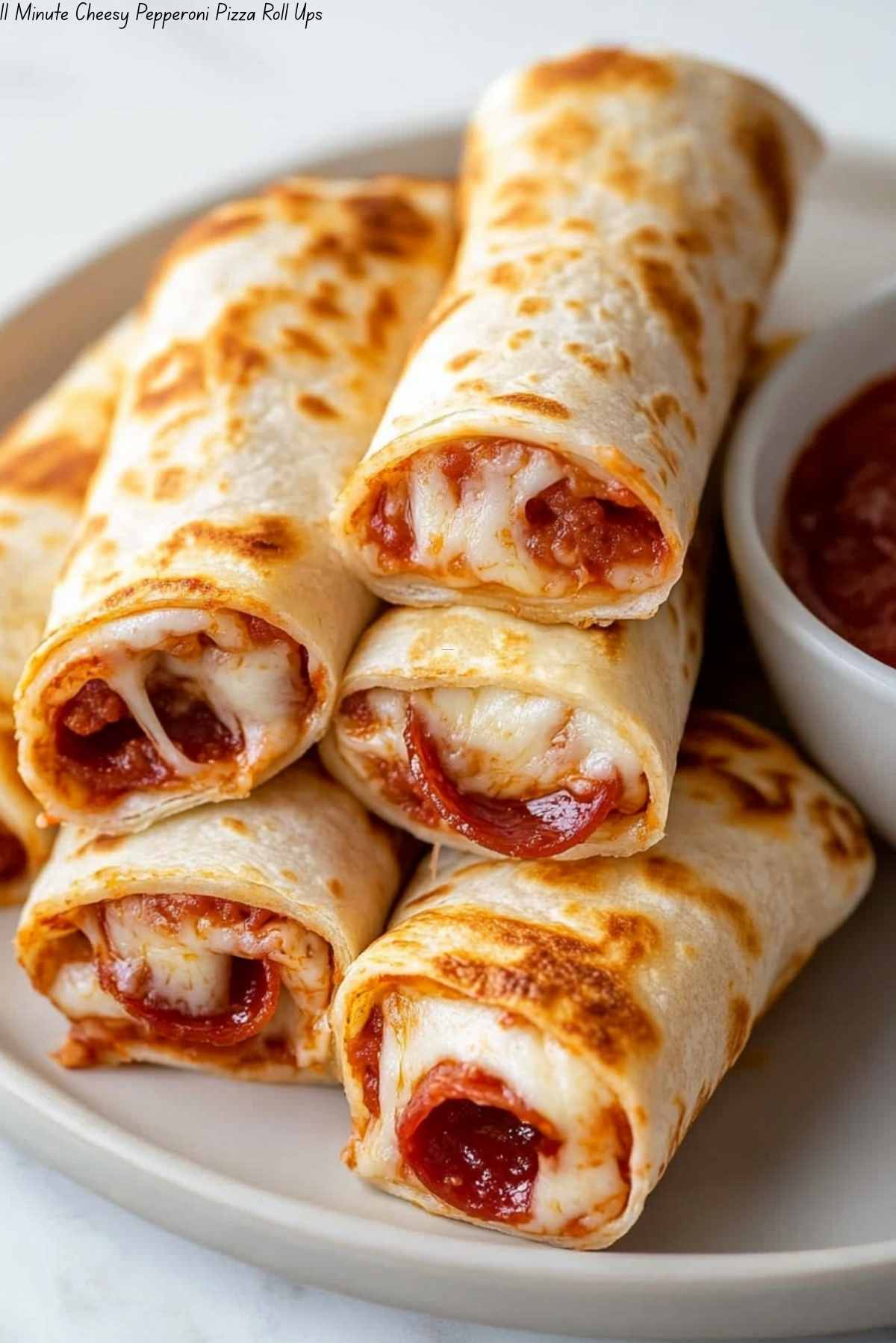 11 Minute Cheesy Pepperoni Pizza Roll Ups